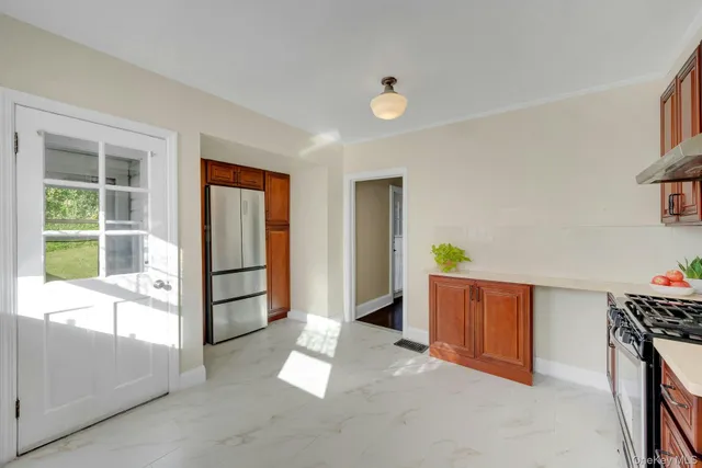 a view of kitchen with furniture and a window
