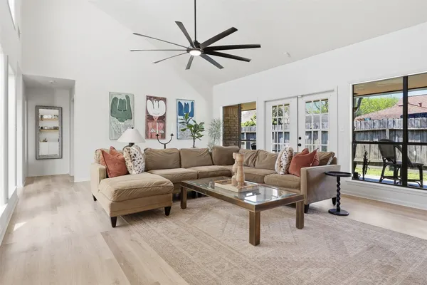 a view of a living room and chandelier