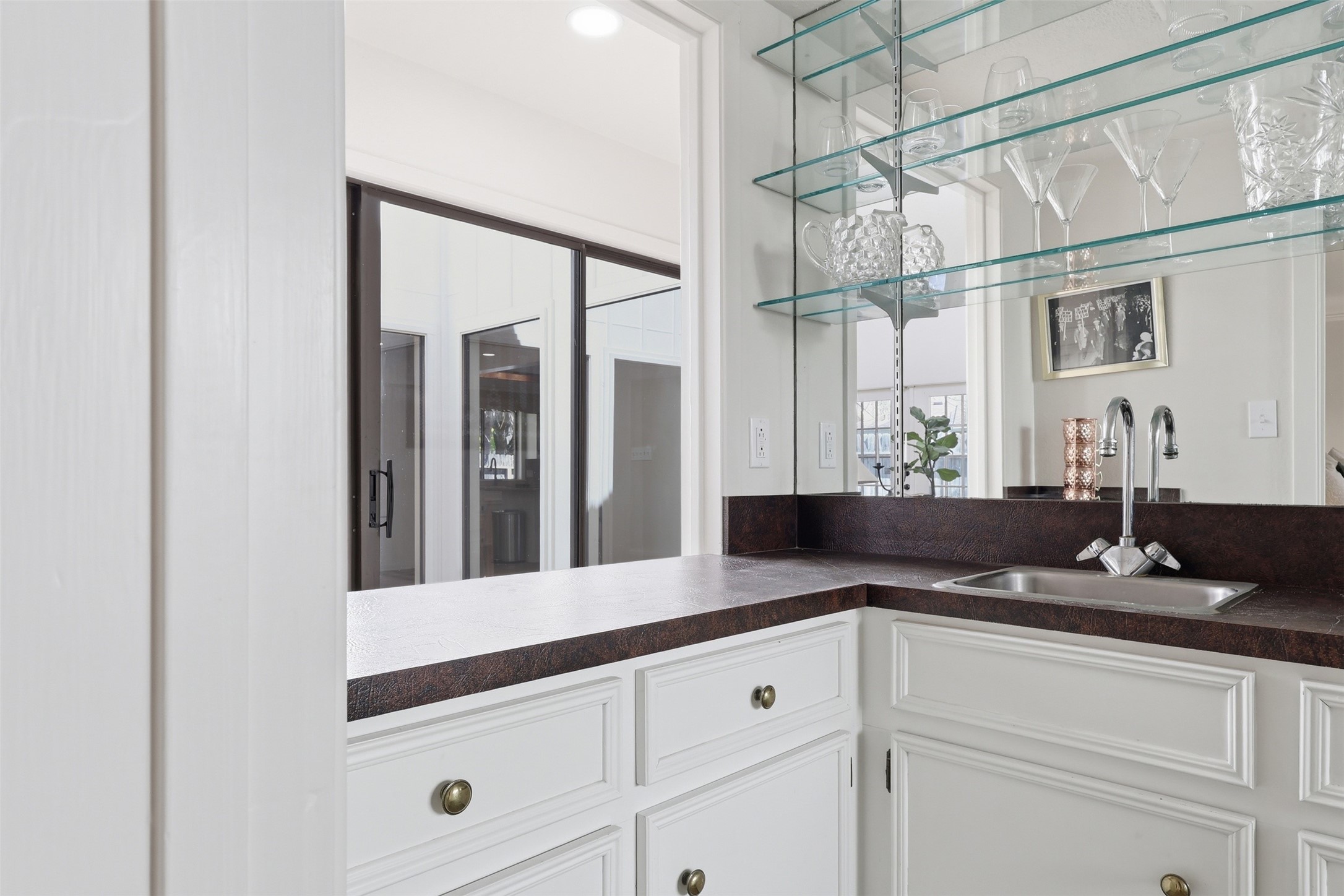 118 Santa Fe Victoria, TX 77904 - Photo 19 of 42 a bathroom with a granite countertop sink mirror and vanity