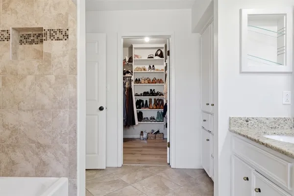 a bathroom with a glass shower door