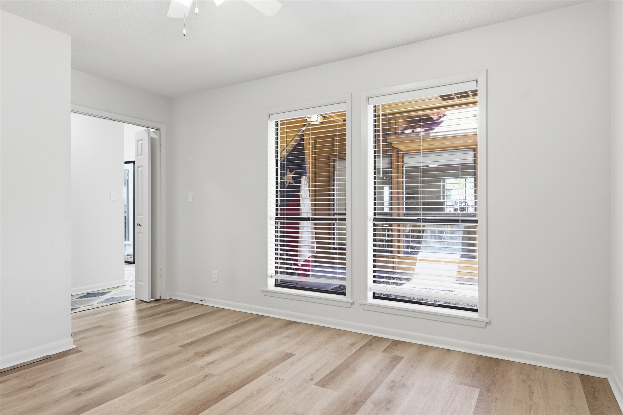 118 Santa Fe Victoria, TX 77904 - Photo 29 of 42 an empty room with wooden floor and windows