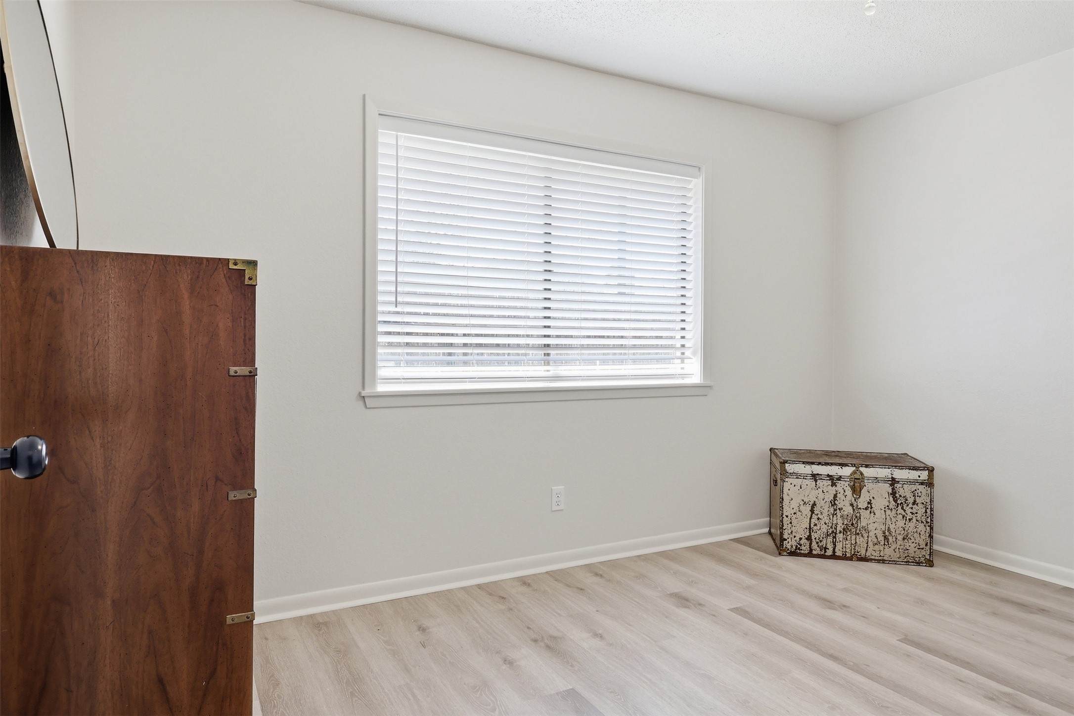 118 Santa Fe Victoria, TX 77904 - Photo 36 of 42 a view of an empty room with wooden floor and a window