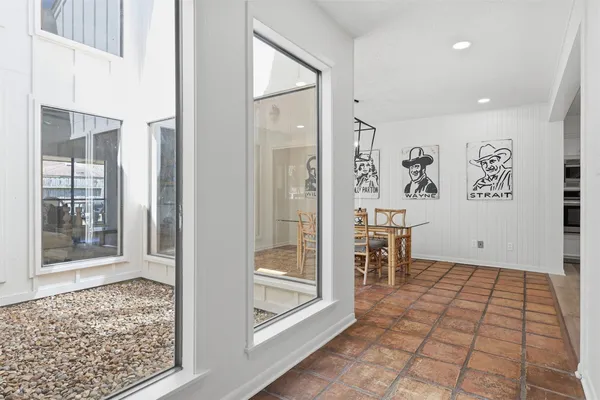 a large kitchen with kitchen island granite countertop a large counter top and stainless steel appliances