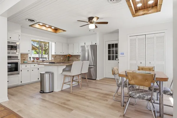 a dining room with furniture and window
