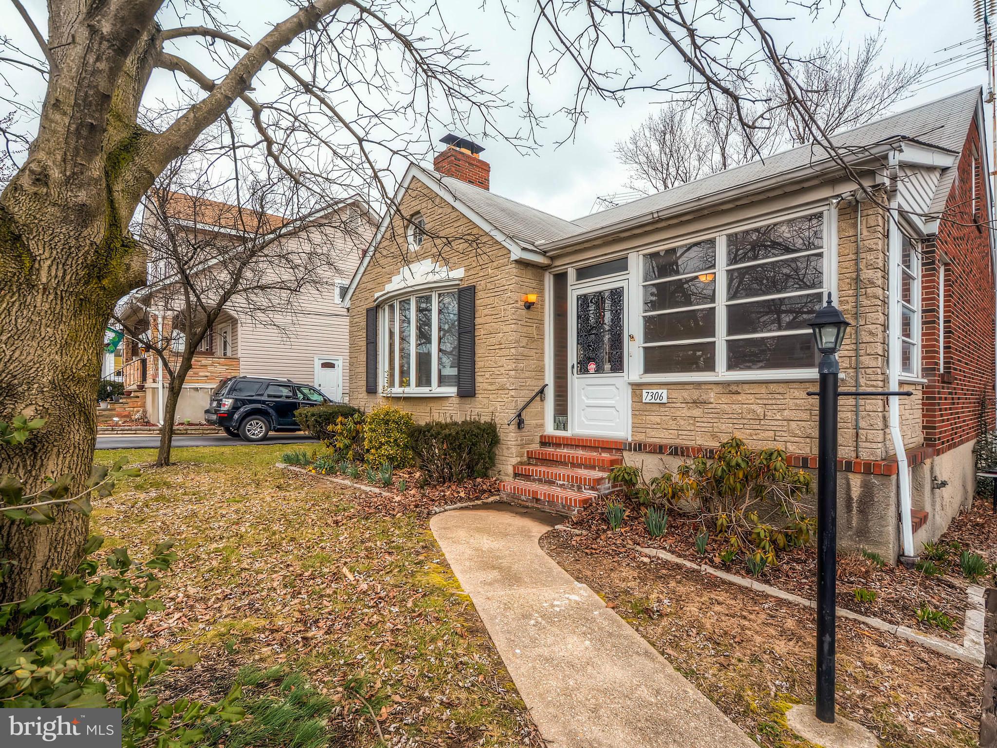 7306 Manchester Road Baltimore, MD 21222 - Photo 1 of 24 a front view of a house with garden