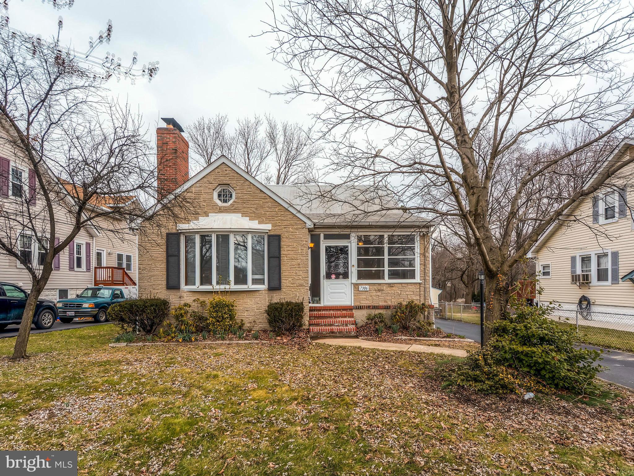 7306 Manchester Road Baltimore, MD 21222 - Photo 2 of 24 a front view of a house with a yard