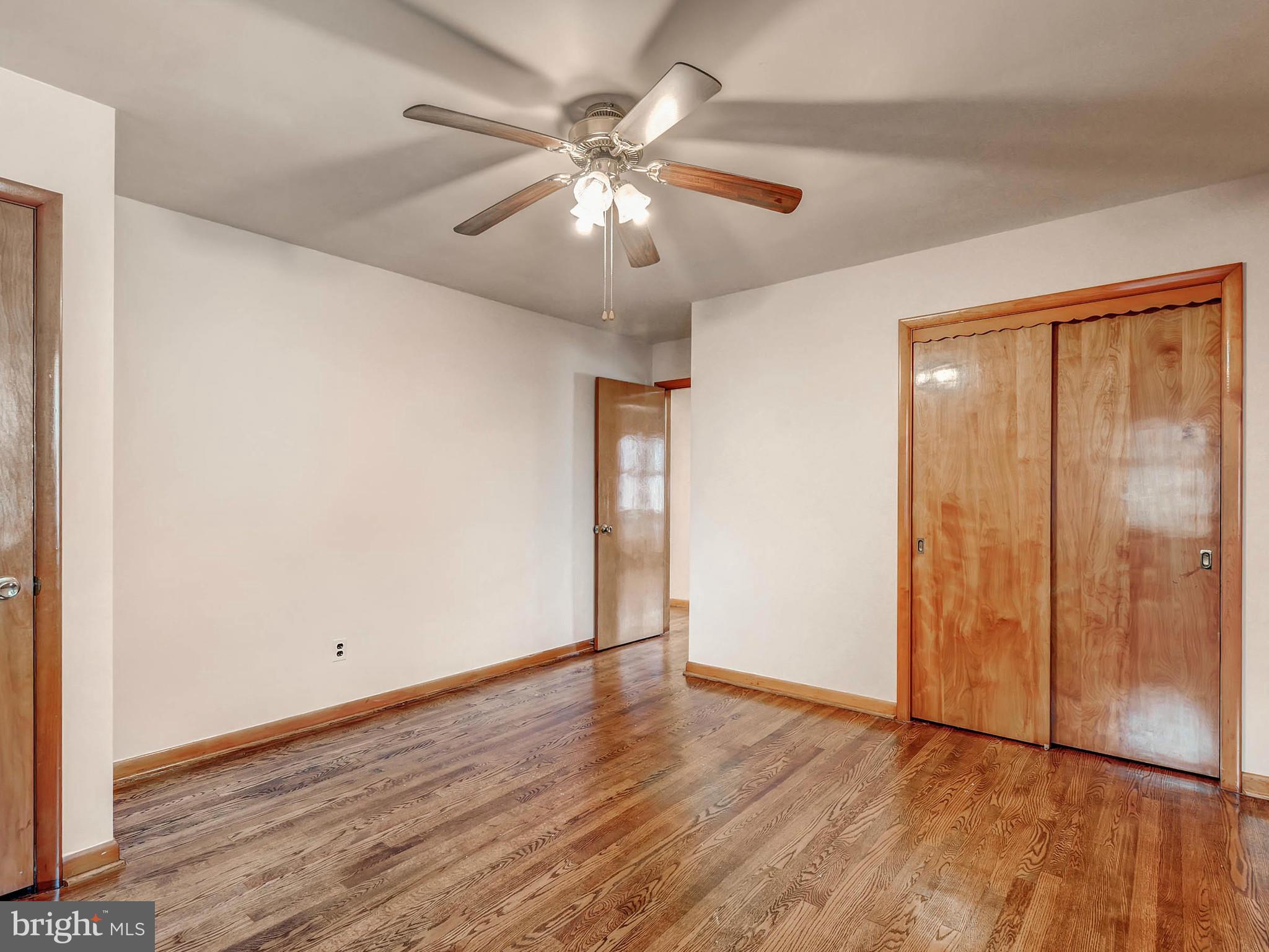 7306 Manchester Road Baltimore, MD 21222 - Photo 14 of 24 a view of an empty room with wooden floor