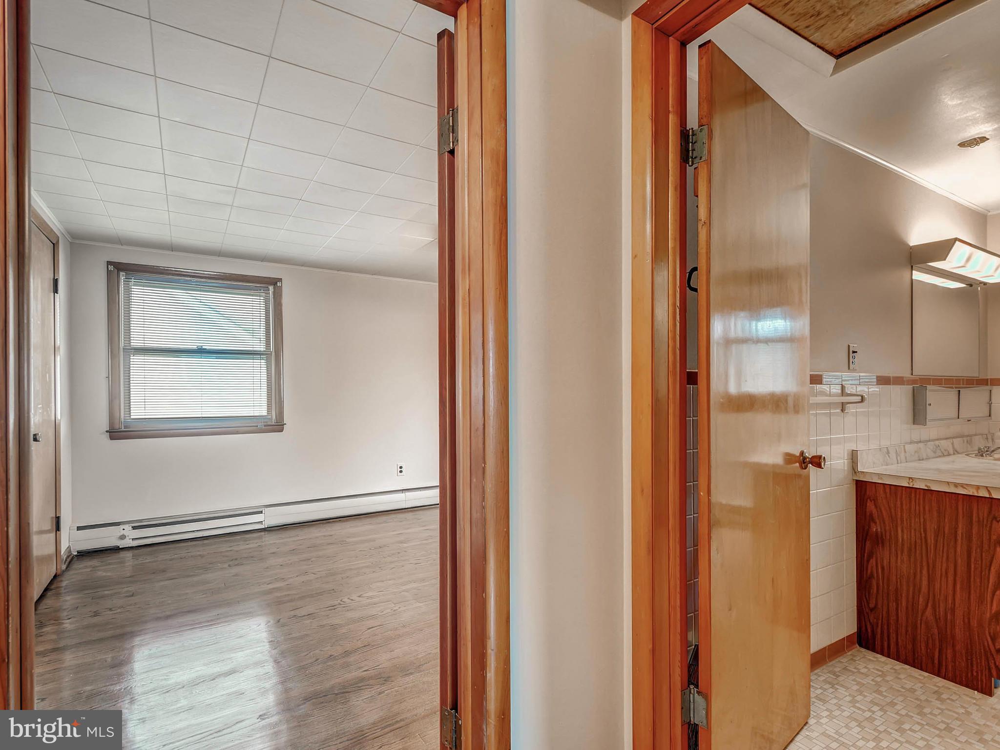 7306 Manchester Road Baltimore, MD 21222 - Photo 20 of 24 a view of a kitchen from a hallway