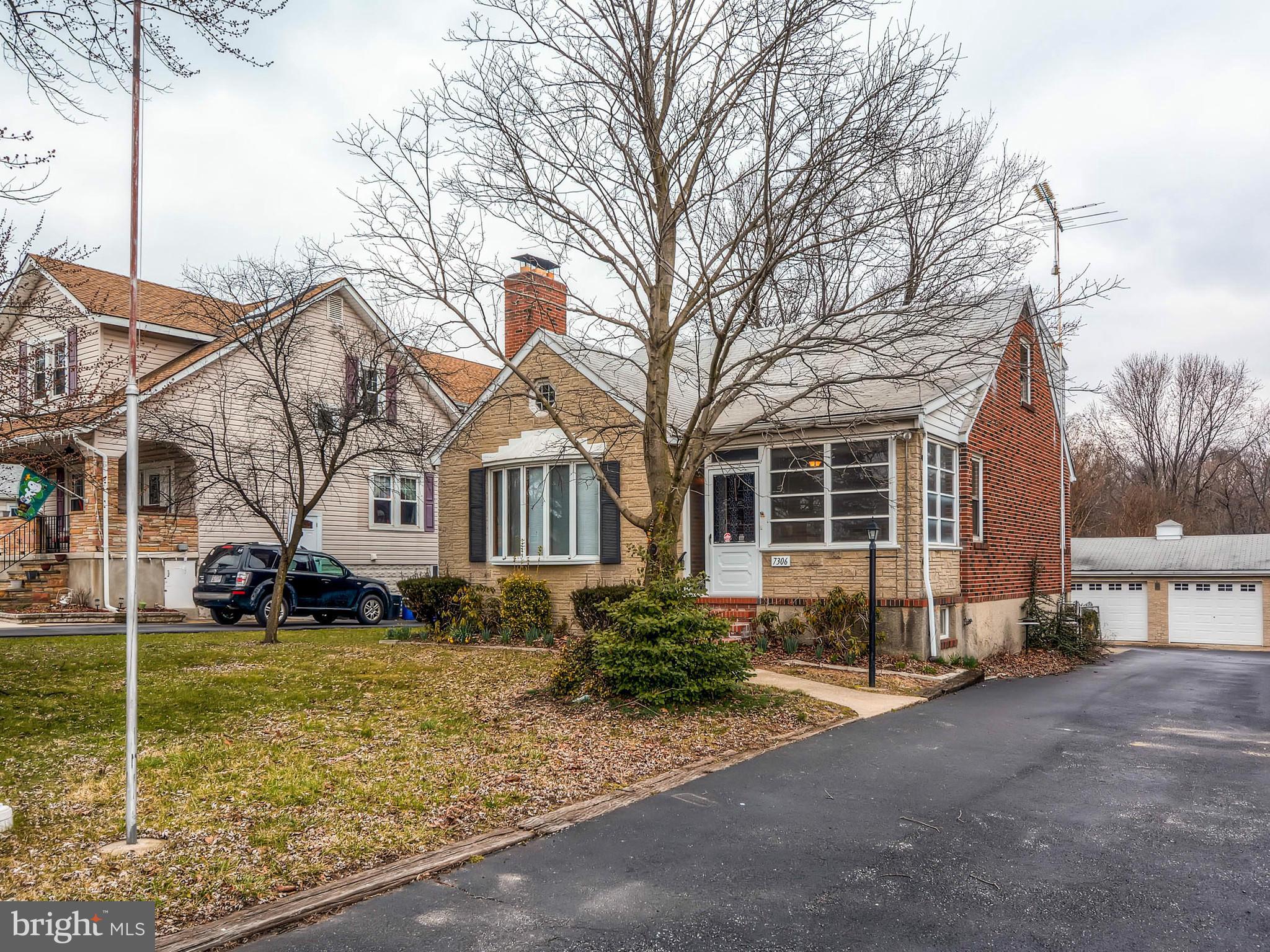 7306 Manchester Road Baltimore, MD 21222 - Photo 3 of 24 a front view of a house with a yard