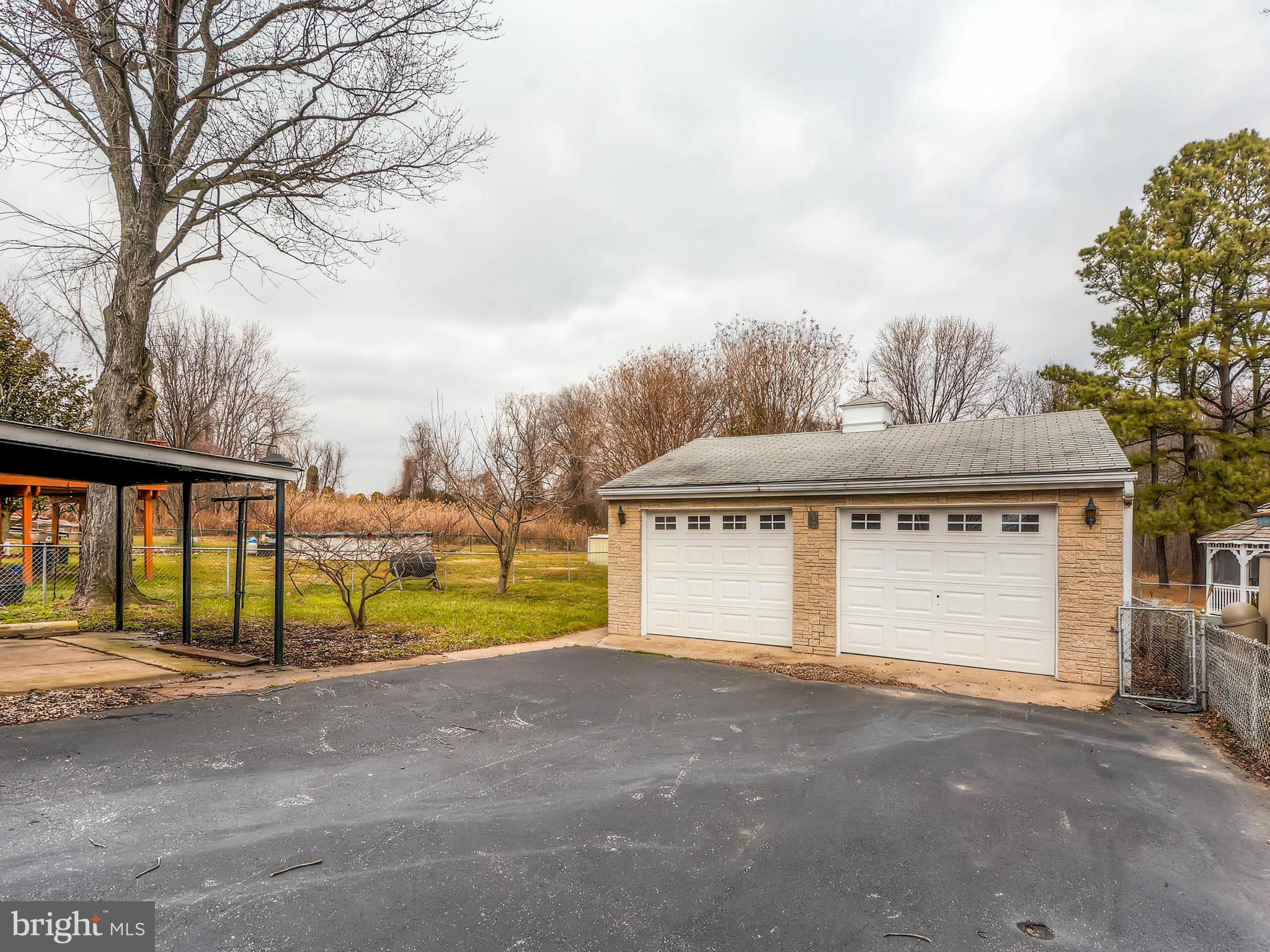 7306 Manchester Road Baltimore, MD 21222 - Photo 21 of 24 a view of house with outdoor space and garage