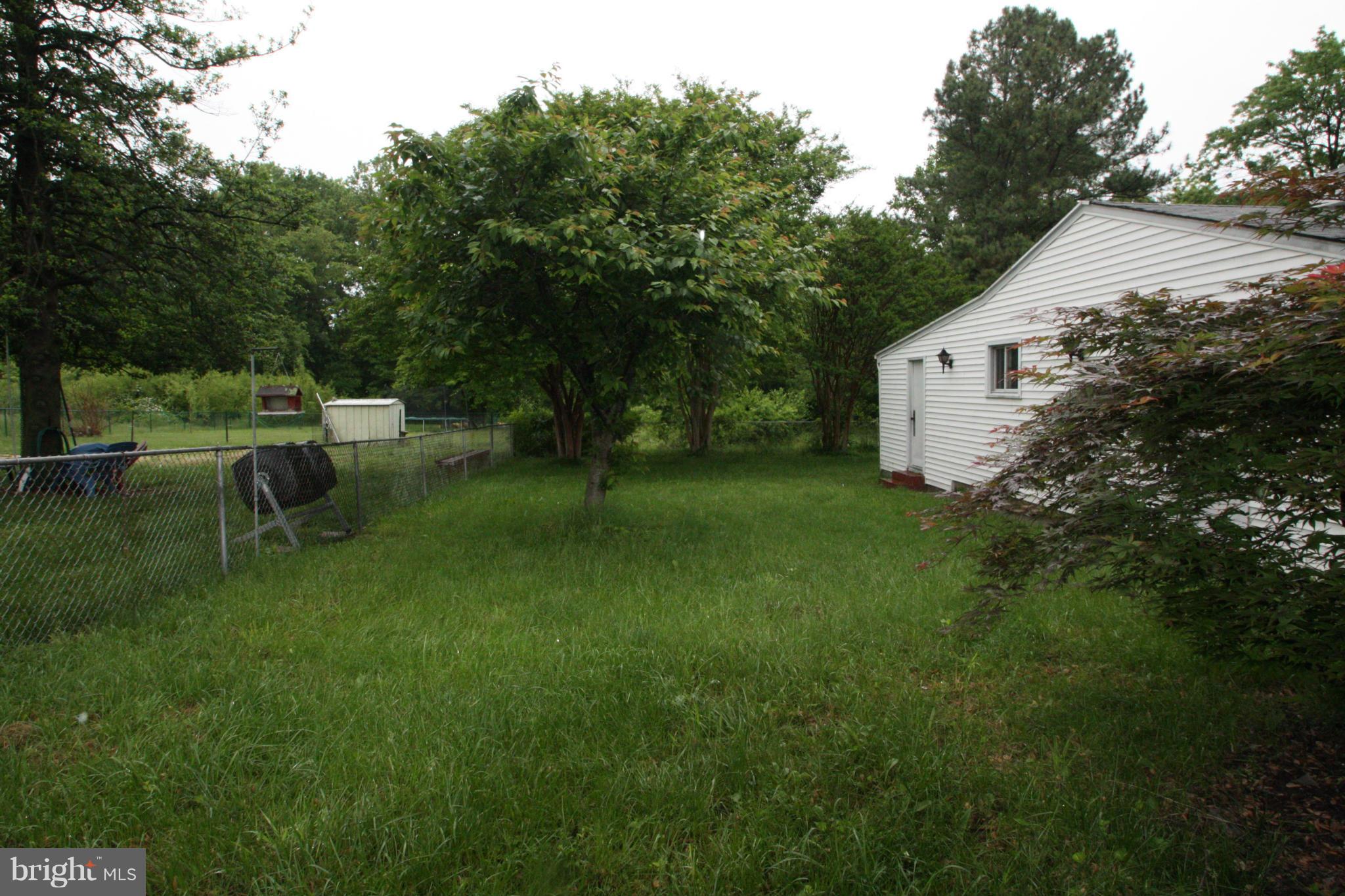 7306 Manchester Road Baltimore, MD 21222 - Photo 23 of 24 a view of backyard of house with green space