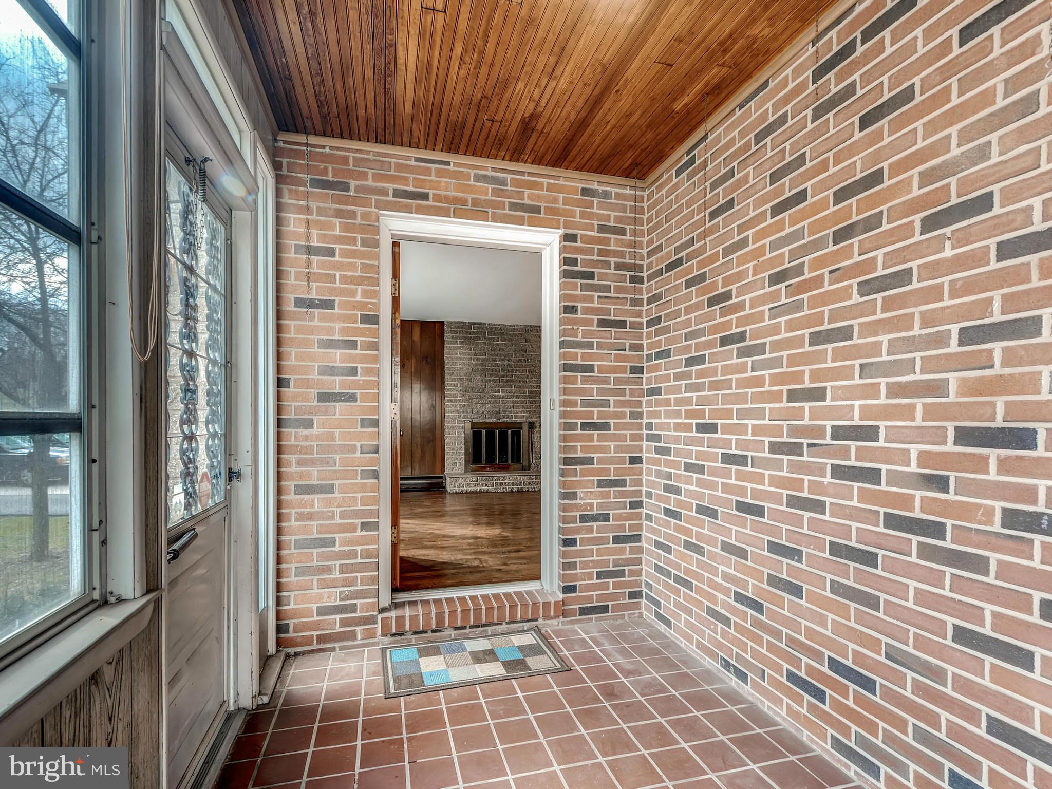7306 Manchester Road Baltimore, MD 21222 - Photo 4 of 24 a view of a brick house with an outdoor space