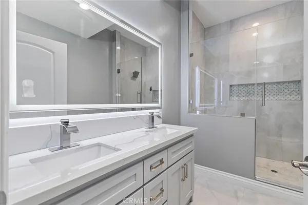 a bathroom with a shower and sink