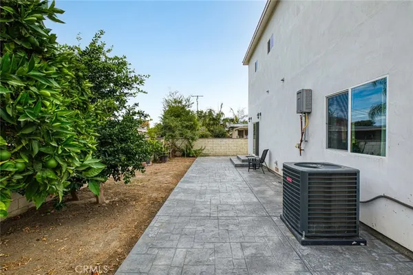 a couple of potted plants in front of door