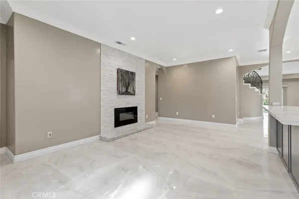 a view of an empty room with a fireplace