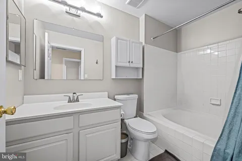 a bathroom with a sink a toilet and a bathtub