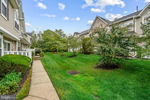 a view of a pathway with a garden