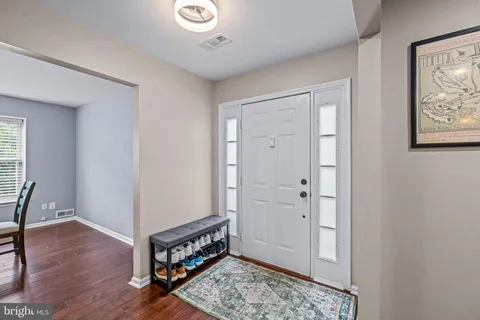 a area with wooden floor and furniture