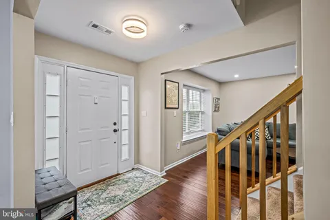 a view of an entryway with wooden floor