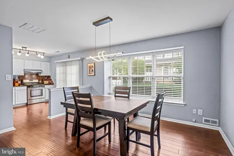a dining room with furniture window wooden floor