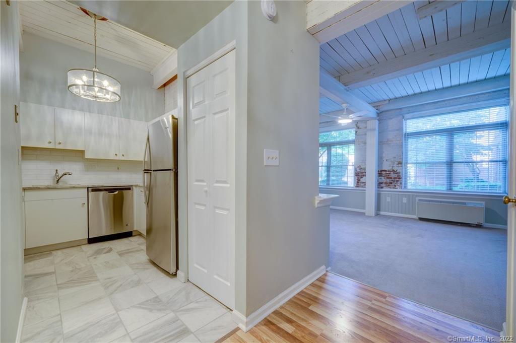 Historic Zipper factory converted to luxury condos. Gorgeous interior recently remodeled unit on the first floor with private entrance