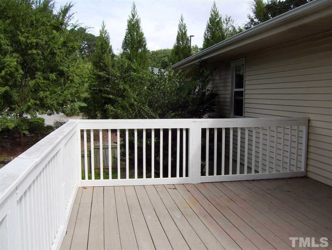 410 Jones Franklin Road Raleigh, NC 27606 - Photo 14 of 17 a side view of a wooden deck