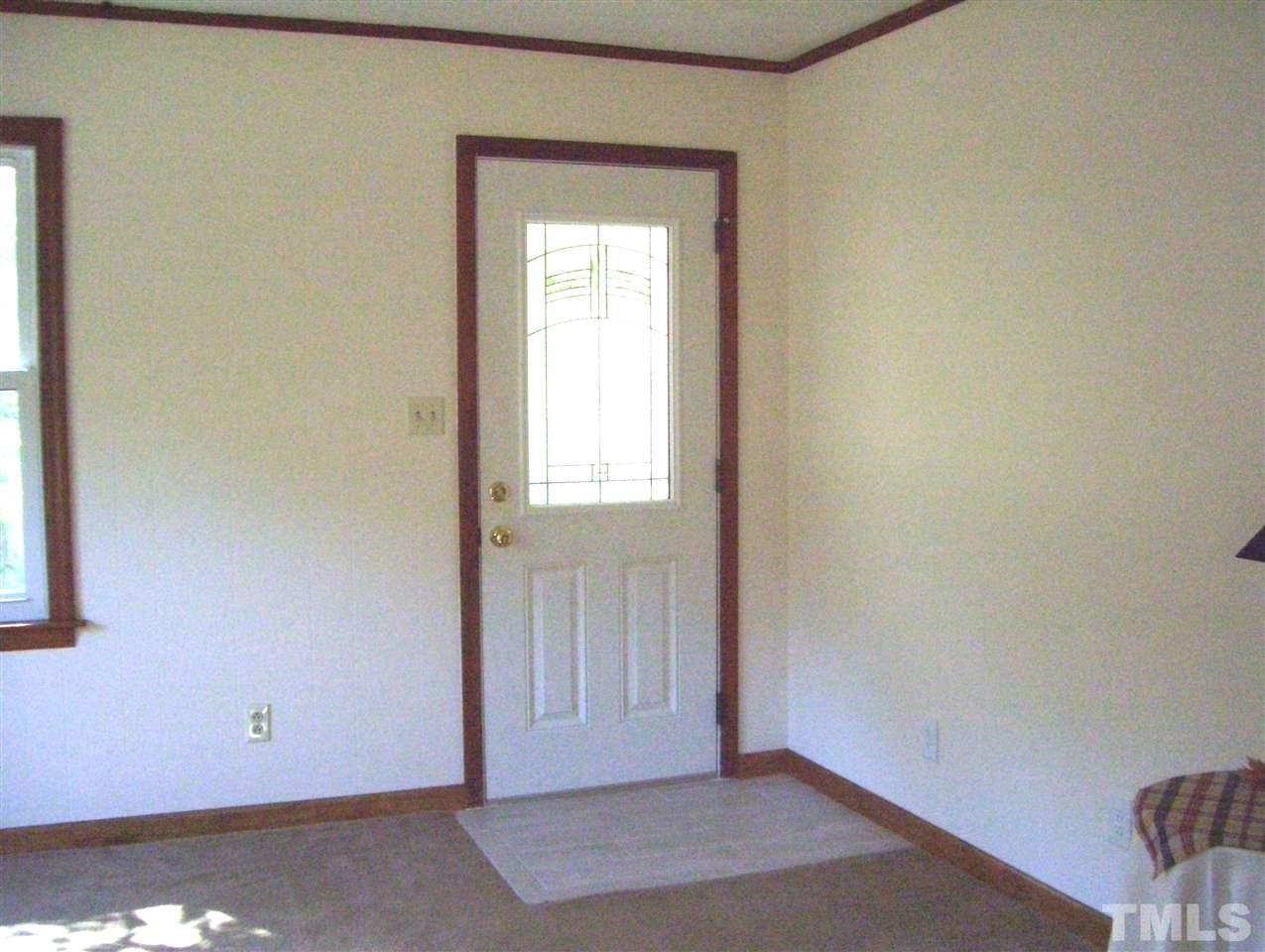410 Jones Franklin Road Raleigh, NC 27606 - Photo 4 of 17 an empty room with windows