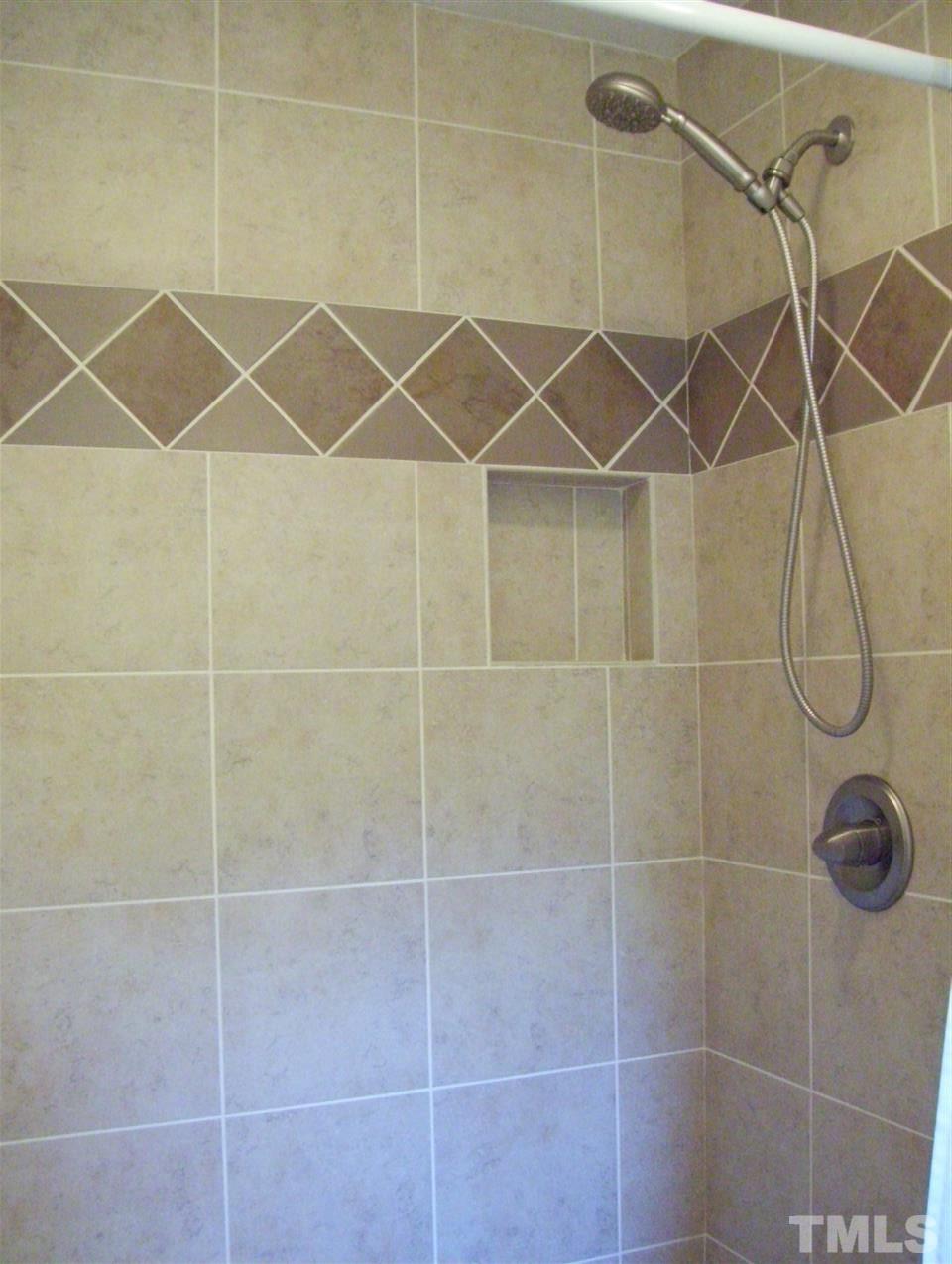 410 Jones Franklin Road Raleigh, NC 27606 - Photo 10 of 17 a bathroom with a shower and a shower