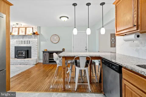 a view of dining room and kitchen with a table chairs