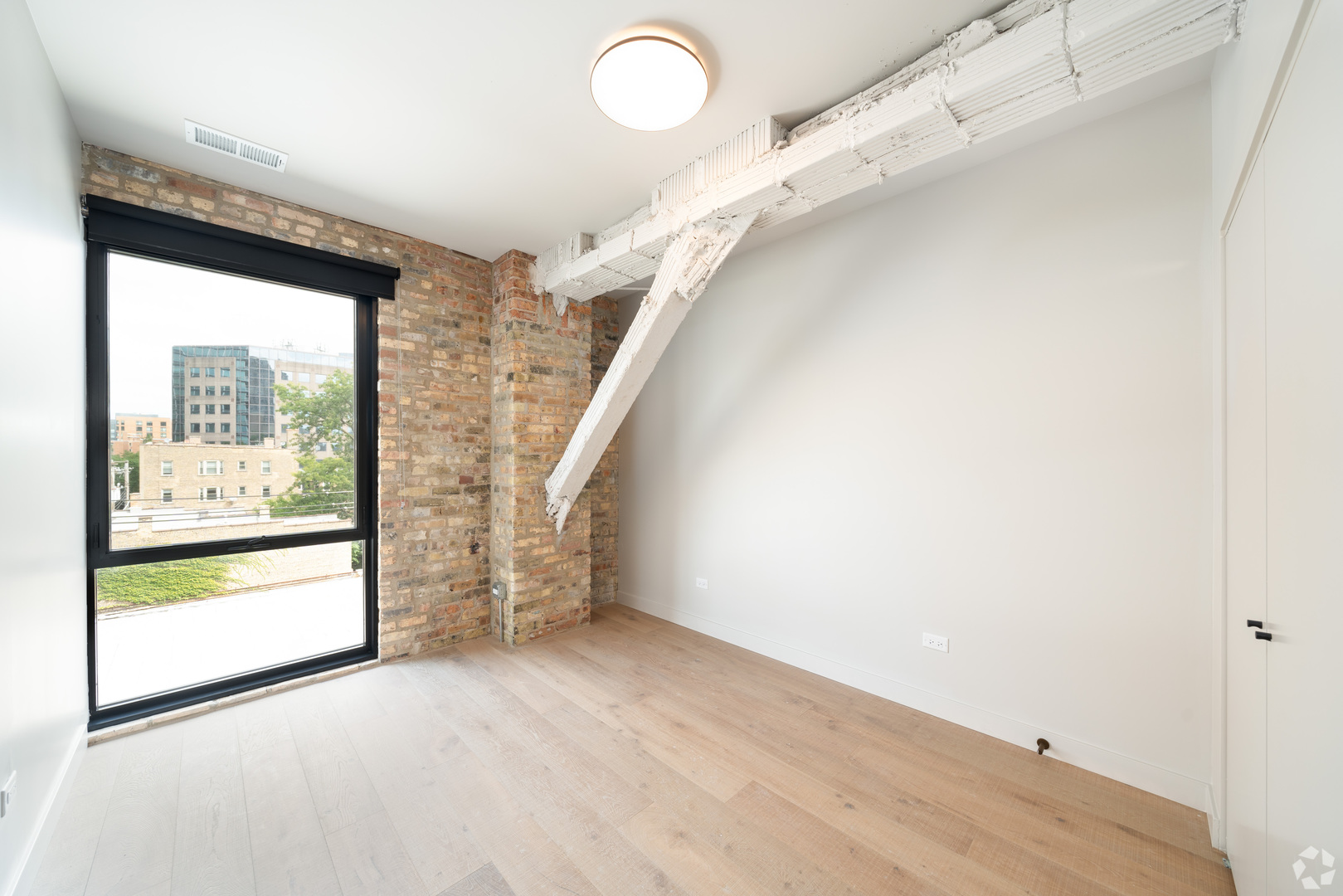 1706 Sherman Avenue, Unit 404 Evanston, IL 60201 - Photo 6 of 8 a view of an empty room with a window