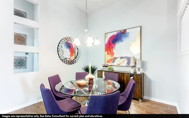 a dining room with furniture and mirror