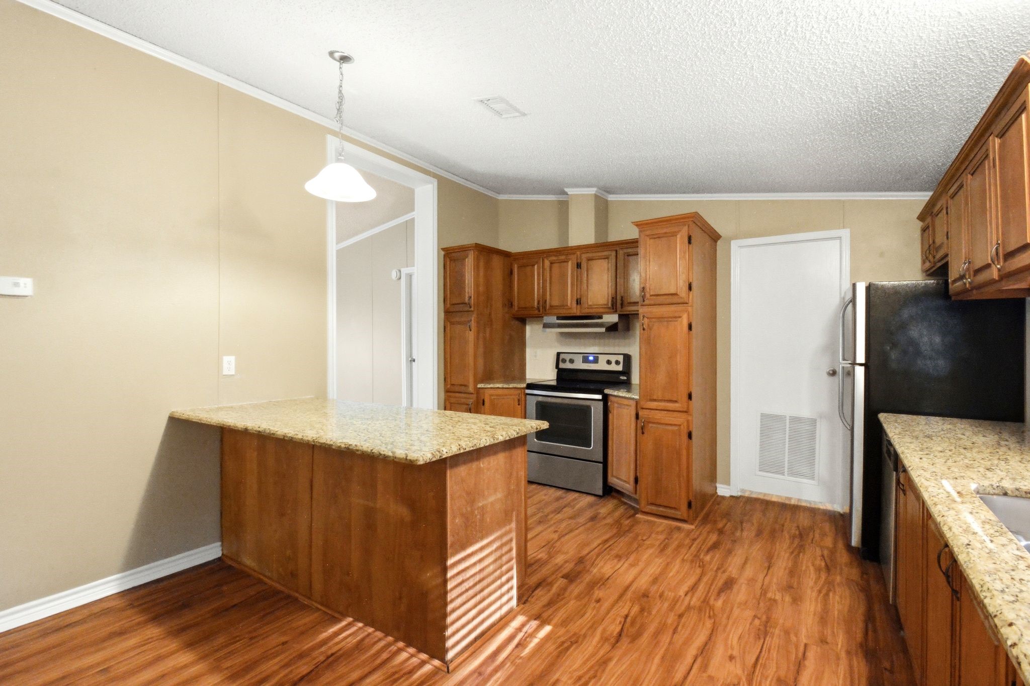 290 Monticello Street Trinity, TX 75862 - Photo 8 of 36 Kitchen Island Offers Additional Prep Space