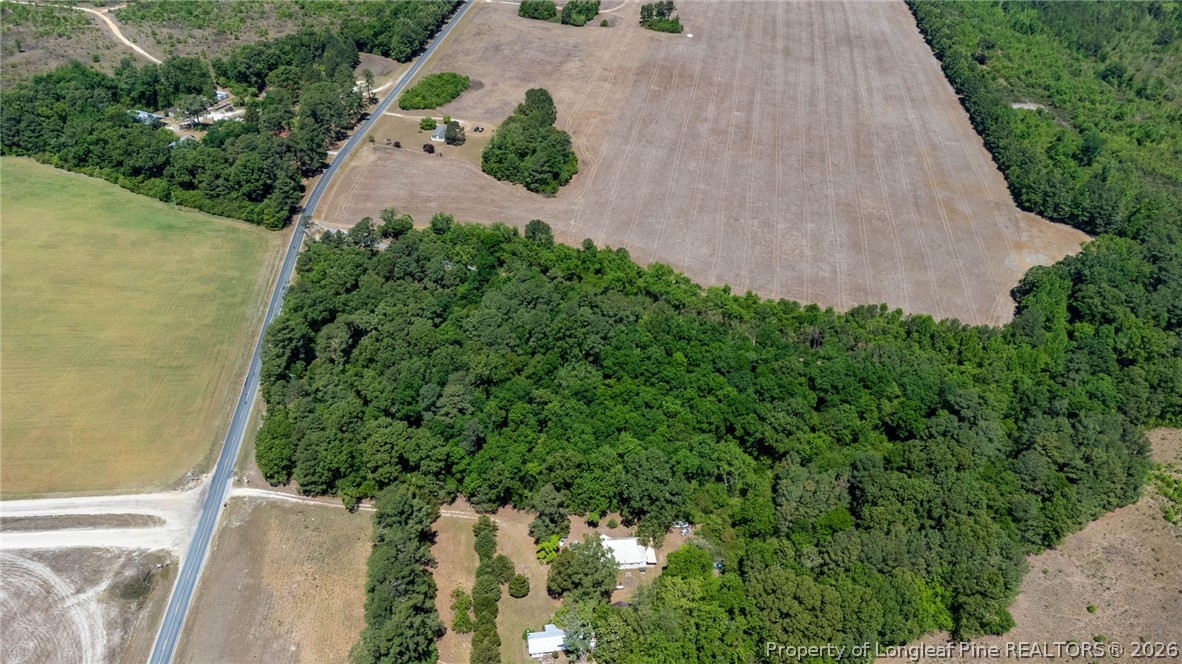 1780 Gainey Road Raeford, NC 28376 - Photo 4 of 12 an aerial view of a house with a yard and garden
