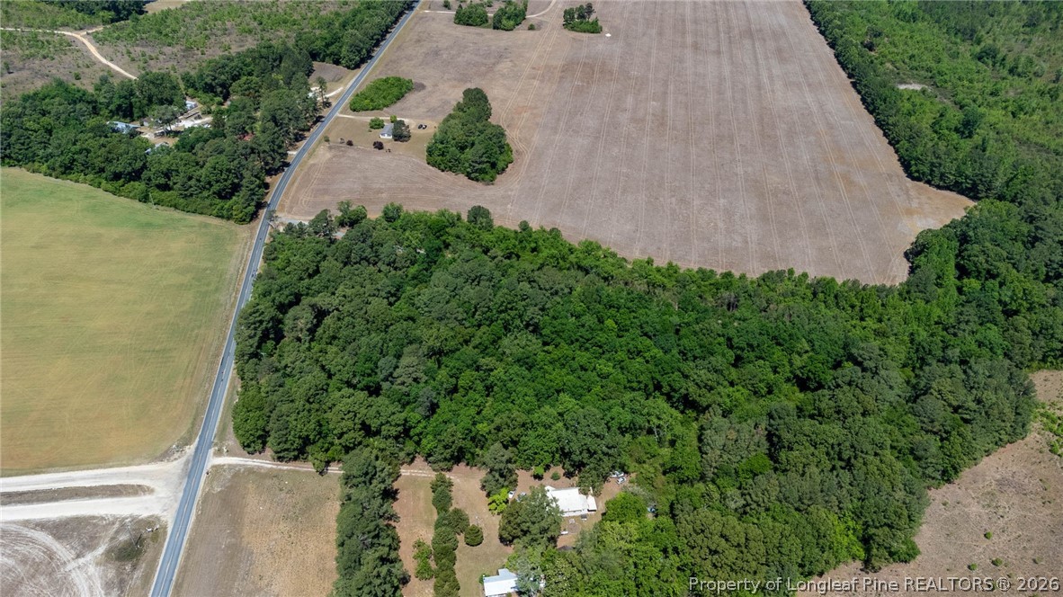 1780 Gainey Road Raeford, NC 28376 - Photo 5 of 12 an aerial view of a house with a yard and garden