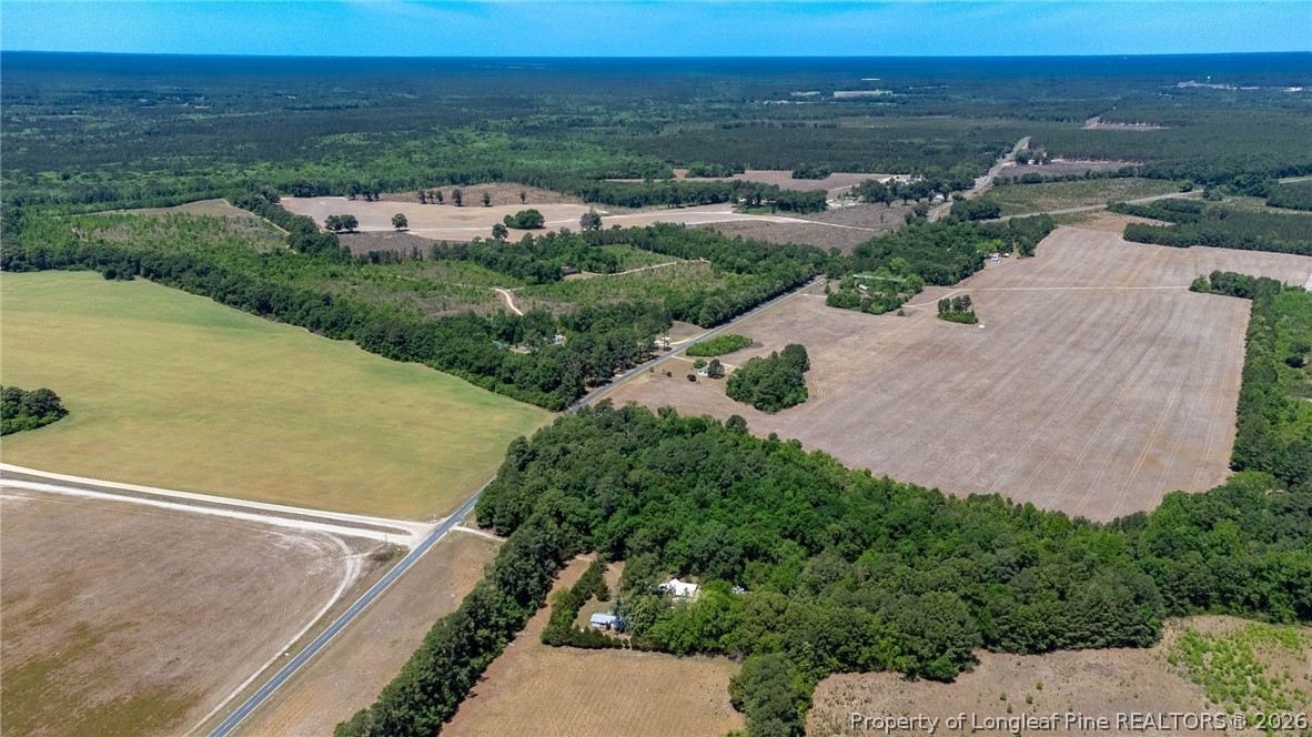 1780 Gainey Road Raeford, NC 28376 - Photo 7 of 12 an aerial view of a house with a garden
