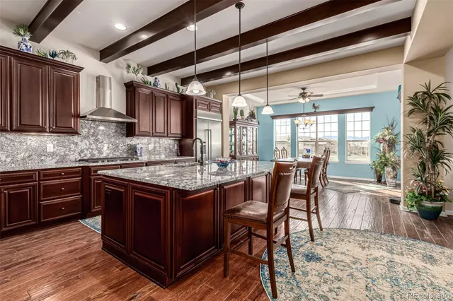 a kitchen with a stove and a wooden cabinets