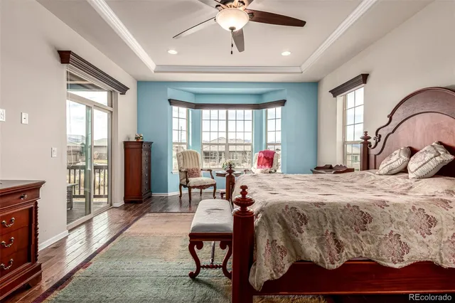 a bedroom with a bed dresser and a window