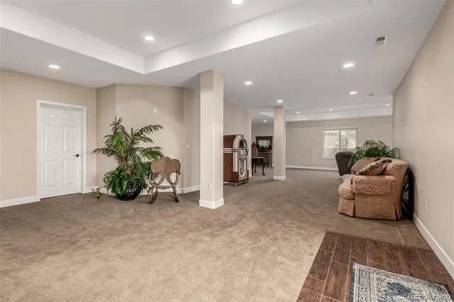 a view of entryway and hall with a workspace