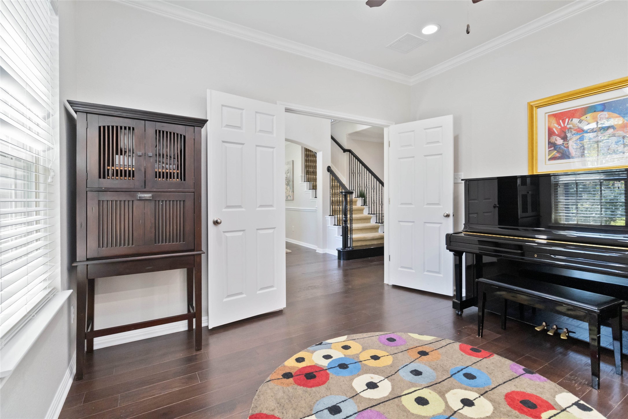8032 Via Verde Drive Austin, TX 78739 - Photo 12 of 37 a bedroom with furniture and a wooden floor