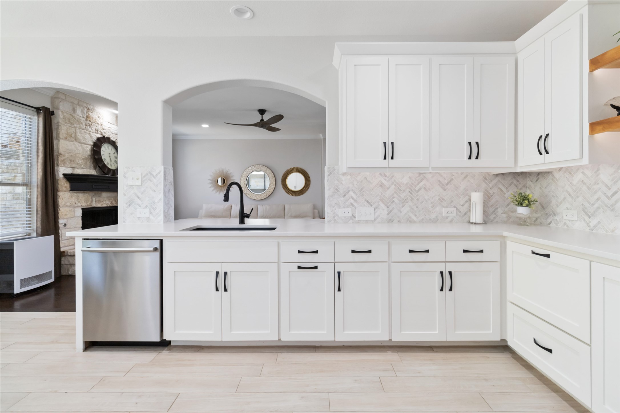 8032 Via Verde Drive Austin, TX 78739 - Photo 15 of 37 a kitchen with white cabinets and white appliances