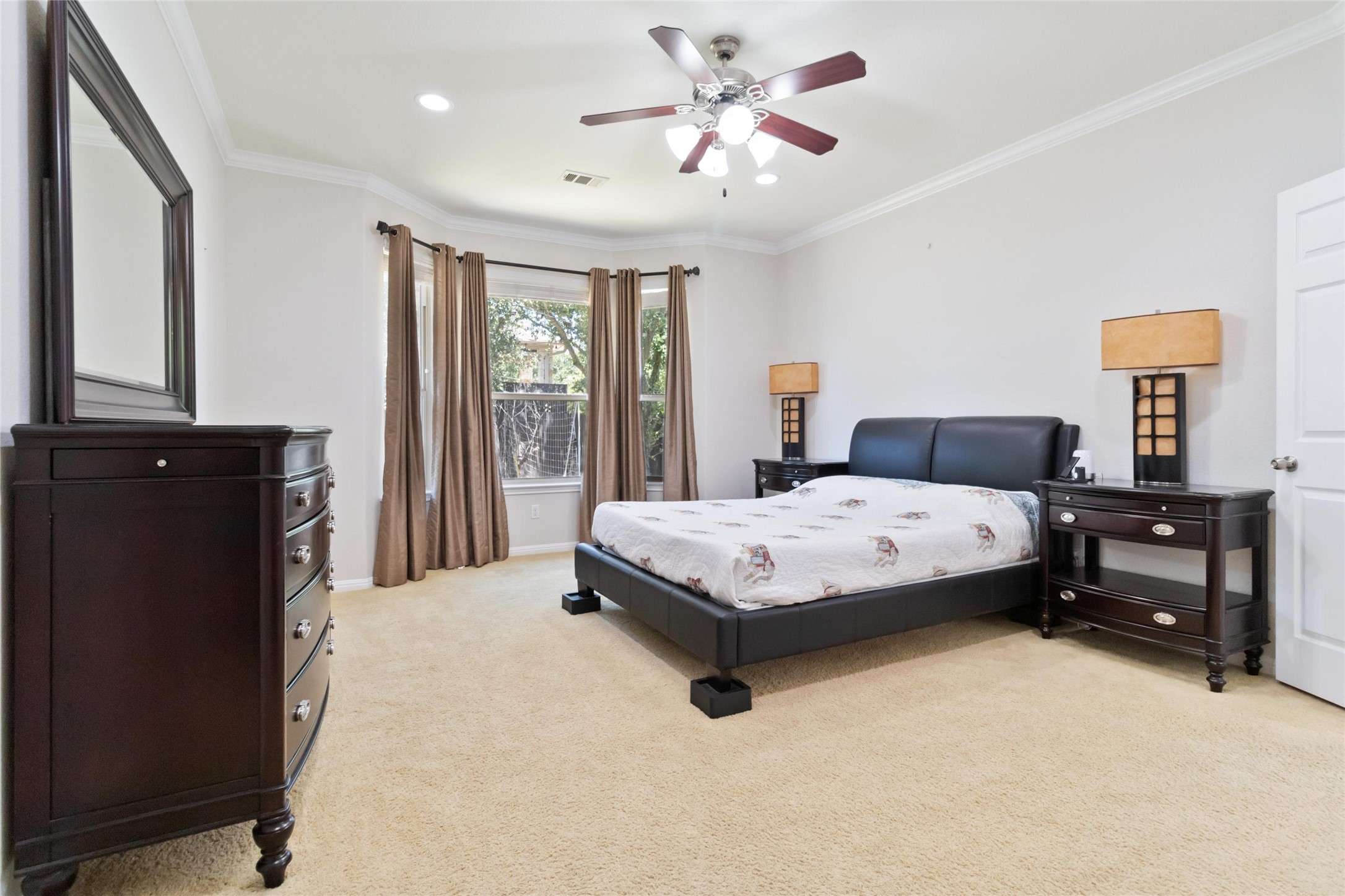 8032 Via Verde Drive Austin, TX 78739 - Photo 17 of 37 a bedroom with a bed and a chandelier