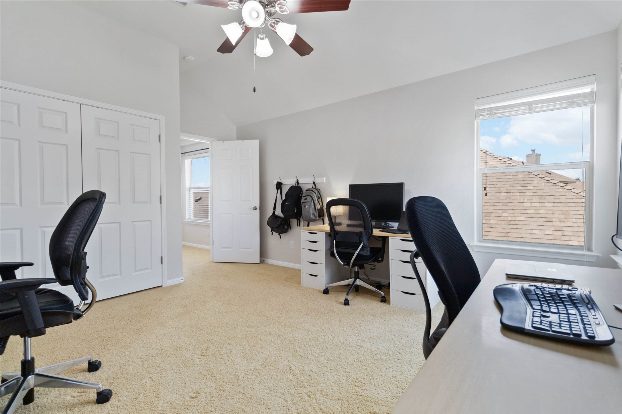 8032 Via Verde Drive Austin, TX 78739 - Photo 27 of 37 a view of a workspace with furniture and a window