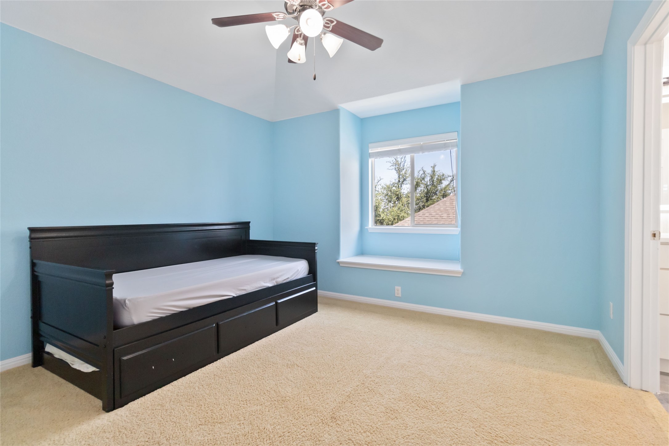 8032 Via Verde Drive Austin, TX 78739 - Photo 30 of 37 a bedroom with a bed and window