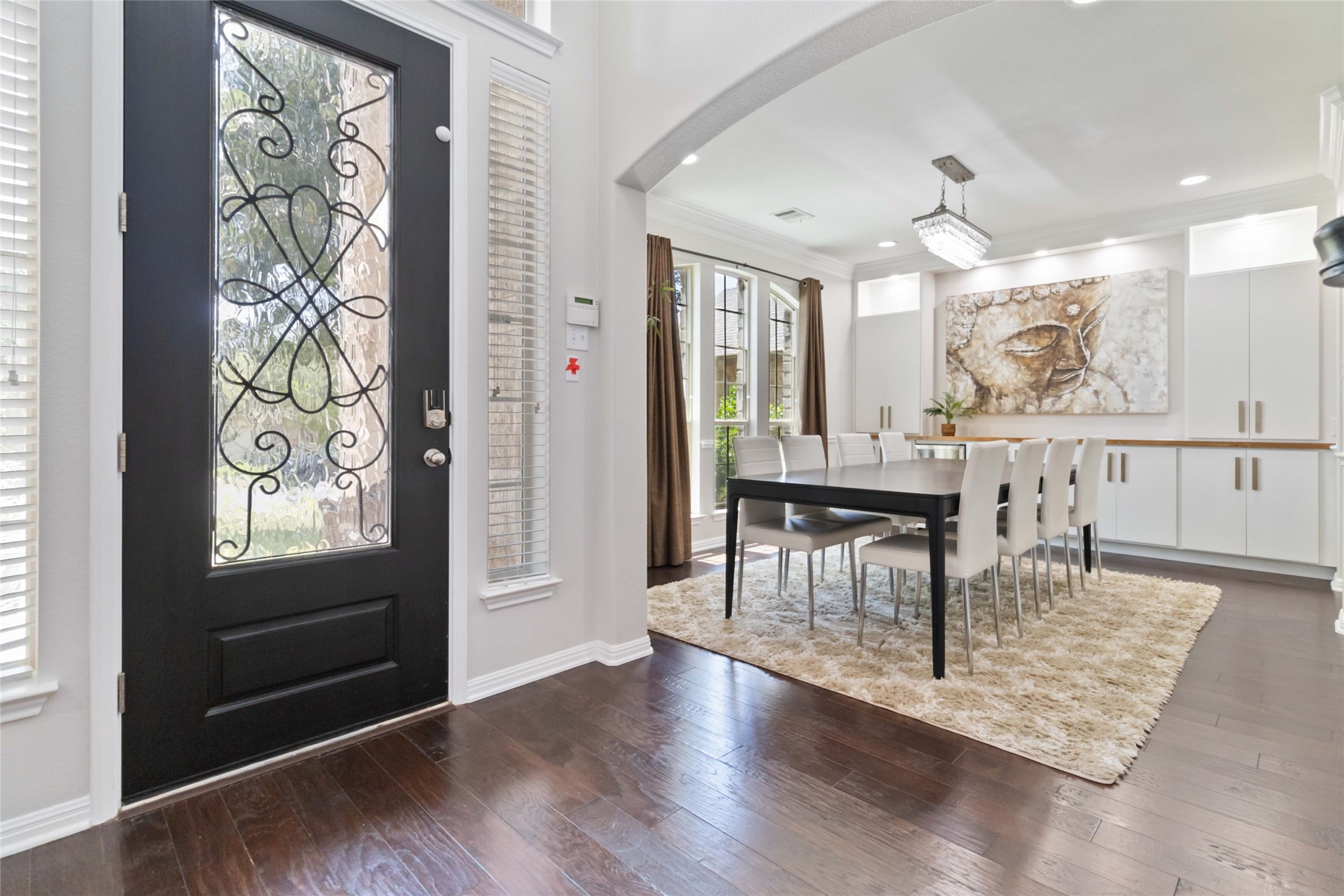 8032 Via Verde Drive Austin, TX 78739 - Photo 3 of 37 a view of a dining room with furniture and wooden floor