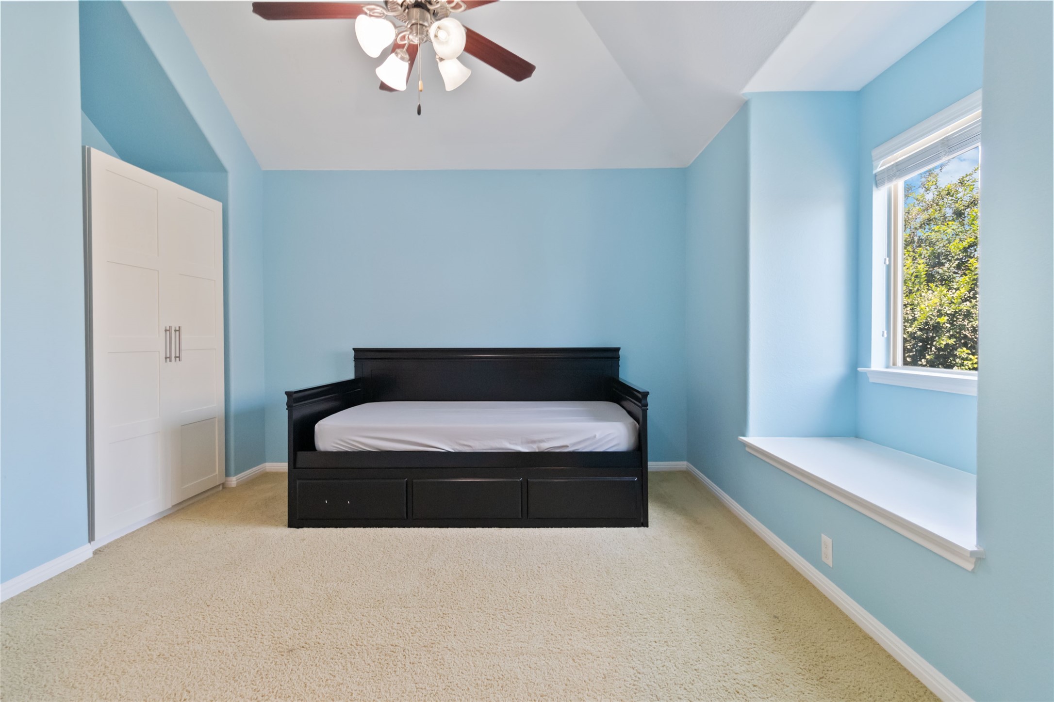 8032 Via Verde Drive Austin, TX 78739 - Photo 31 of 37 a living room with a couch and a chandelier