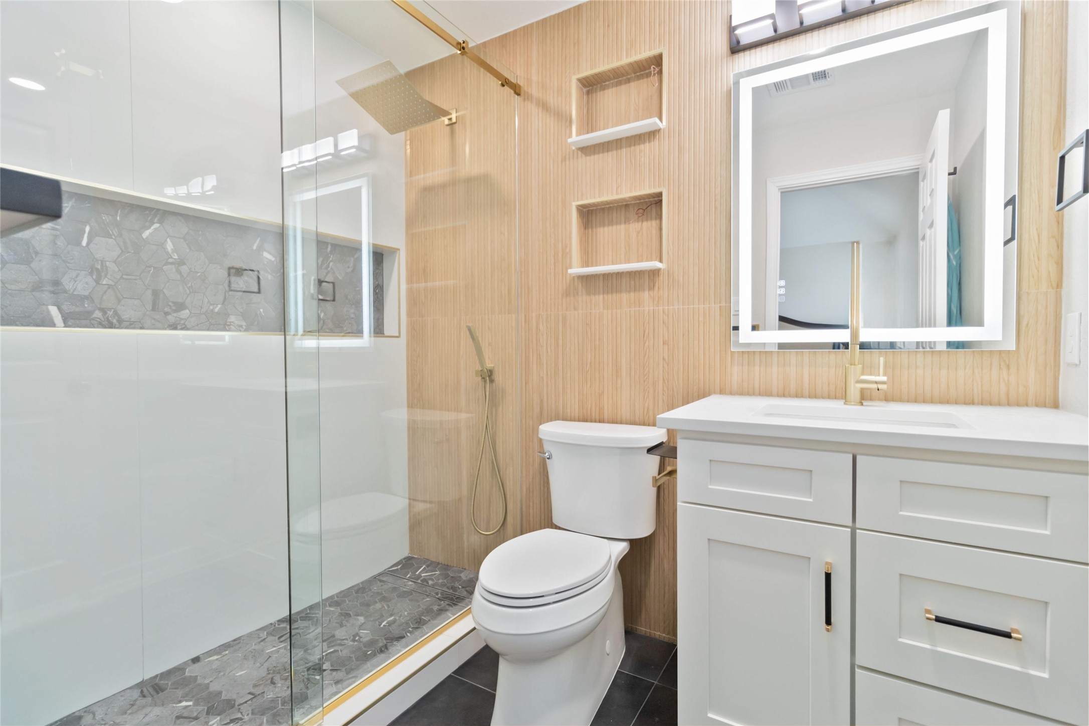 8032 Via Verde Drive Austin, TX 78739 - Photo 34 of 37 a bathroom with a toilet a sink and shower