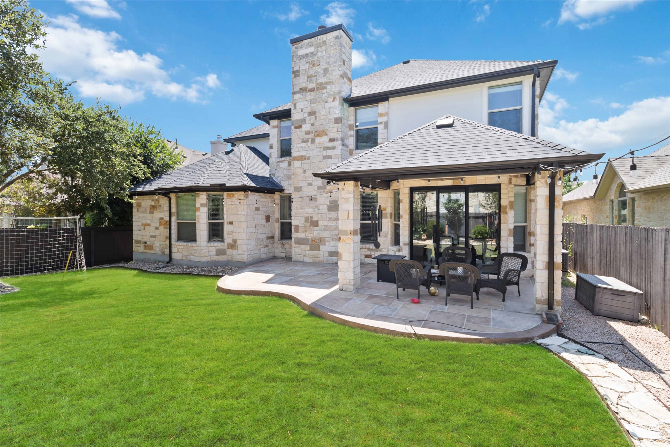 8032 Via Verde Drive Austin, TX 78739 - Photo 37 of 37 a view of a house with a yard and patio