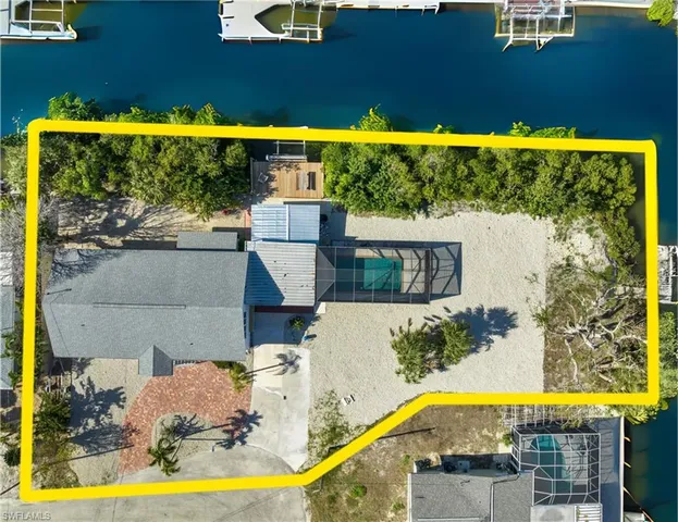 a view of swimming pool and outdoor seating