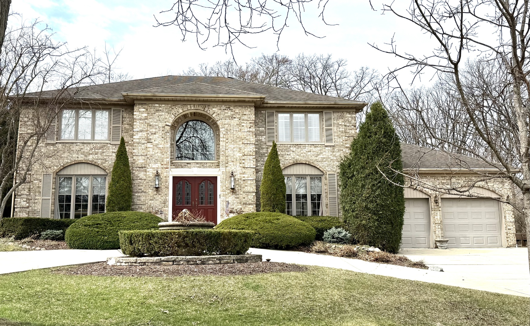 front view of a house with a yard