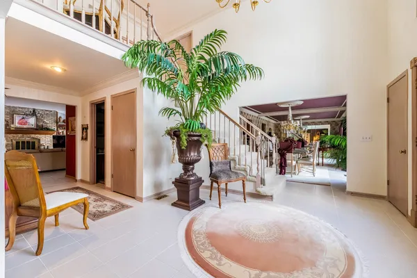 a view of a livingroom with furniture and a porch
